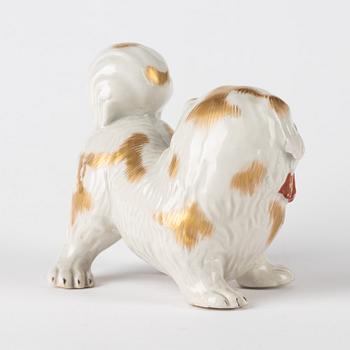 A Japanese Hirado ware style okimono in the shape of a dog, 20th Century.