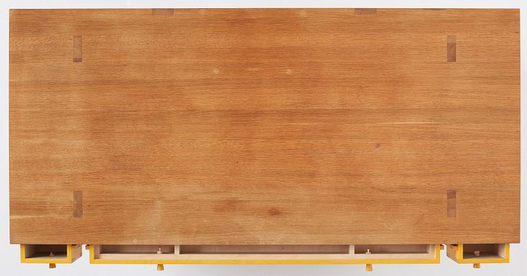 Lars Stensö, Lars Stensö, a "Singer" desk, Sweden. Table top and legs made of oak. Three yellow painted drawe...