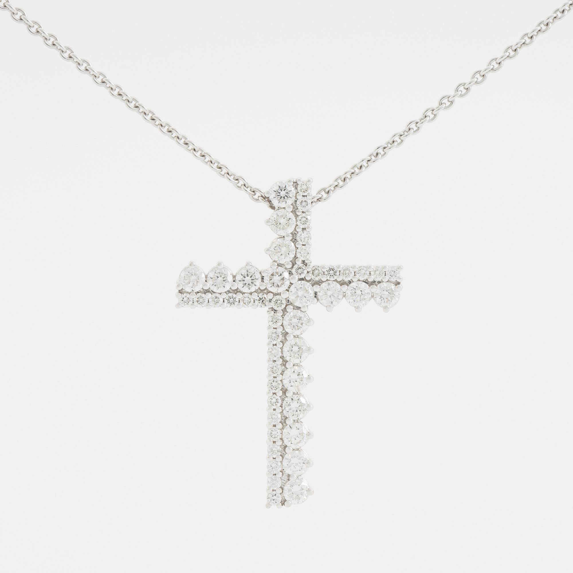 Brilliant cut diamond cross necklace.
