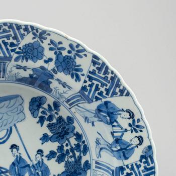 A large blue and white deep dish, Qing dynasty, with Kangxi six character mark and period (1662-1722).