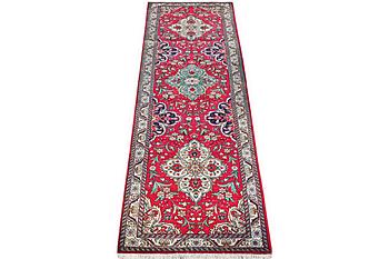 A runner carpet, Tabriz, c. 402 x 88 cm.