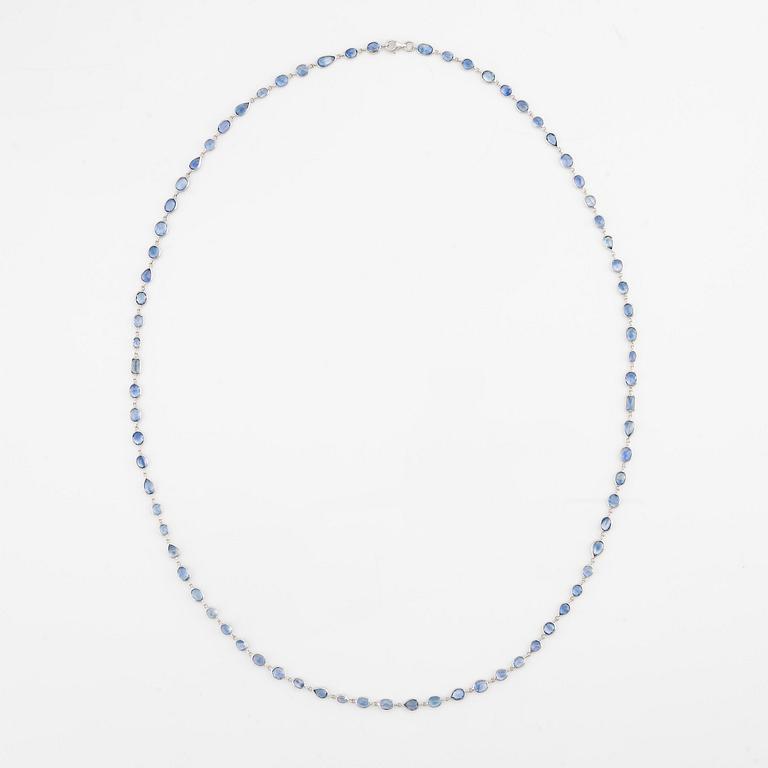 An 18K white gold necklace set  with faceted sapphires.