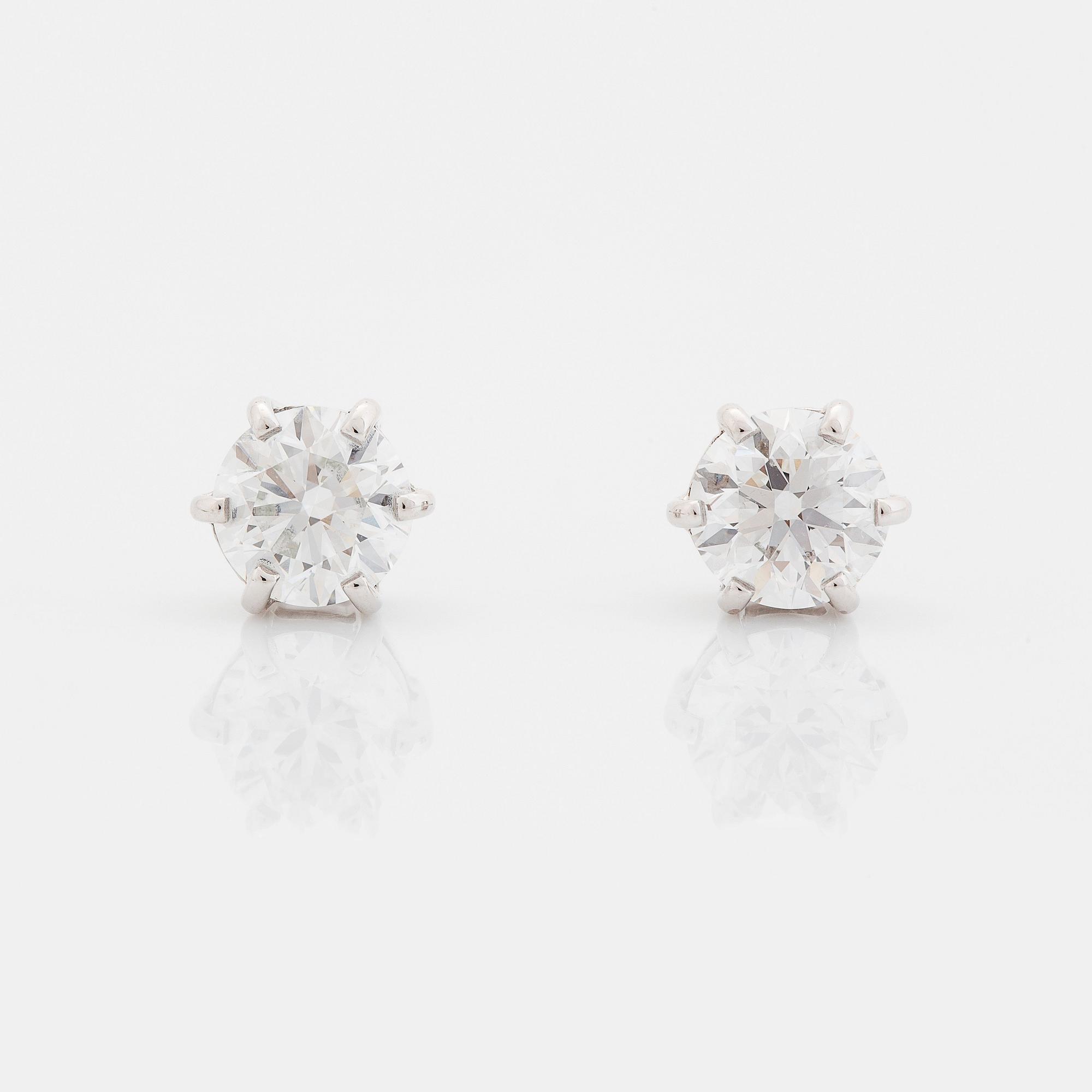 A pair of platinum earrings set with round brilliant-cut diamonds total weight 2.00 cts D if (internally flawless).