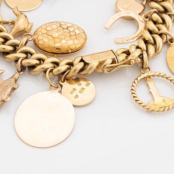 18K gold charm bracelet.