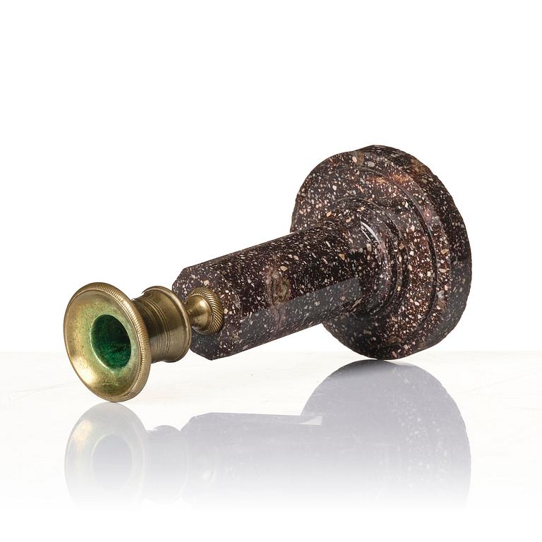 An Empire 'Blyberg' porphyry candlestick from Älvdalen, first part 19th century.