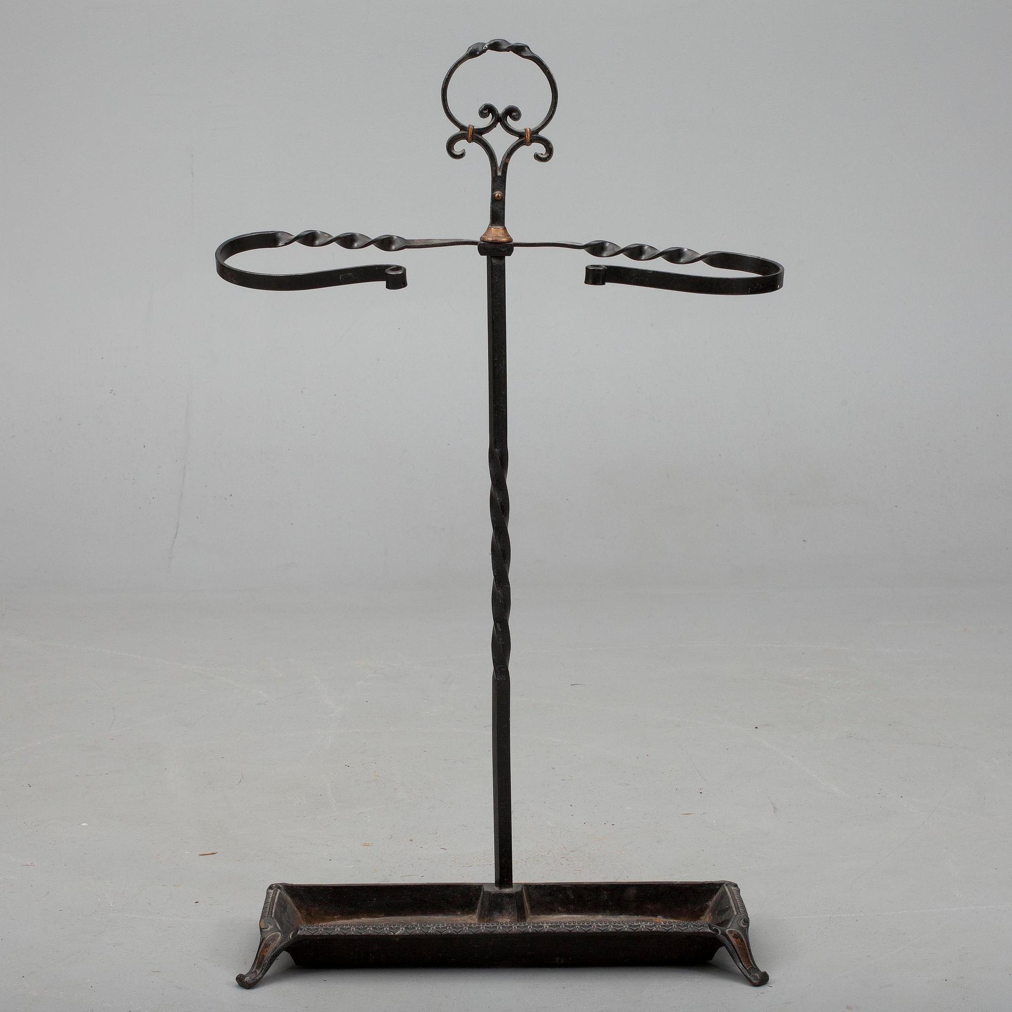 BRASSKYDD / PARAPLYSTÄLL, järn, 1900-talets slut.