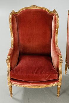 A pair of lounge chairs from the first half of the 20th century.