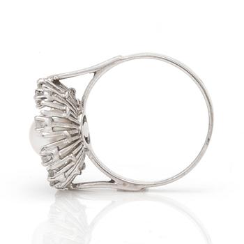 A ring with a cultured pearl surrounded by round, brilliant-cut diamonds.