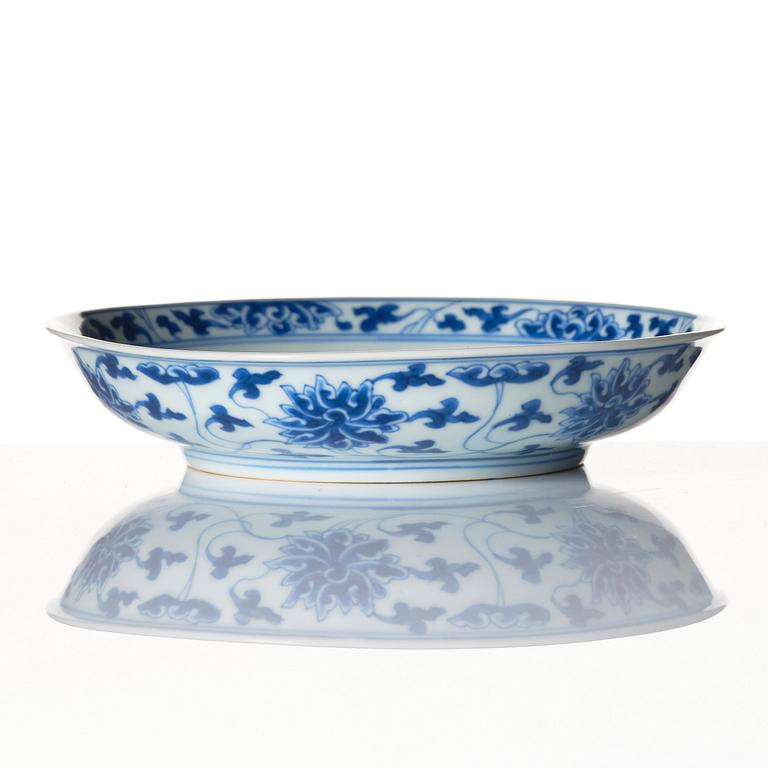 A blue and white lotus dish, Qing dynasty, Kangxi six character mark and of the period (1662-1722).