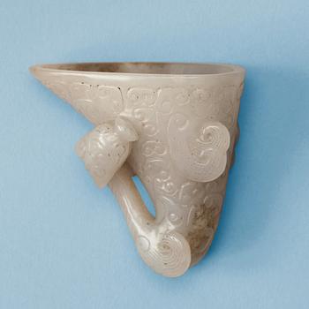 1400. A carved white nephrite libation cup, China.
