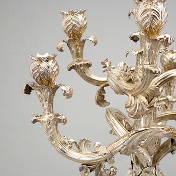 A pair of Neo-Rococo silver candelabra by Gustaf Möllenborg, Stockholm, 1845. Total weight ca 5920 grams.