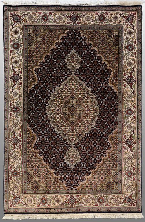 An oriental rug, around 150 x 105 cm.