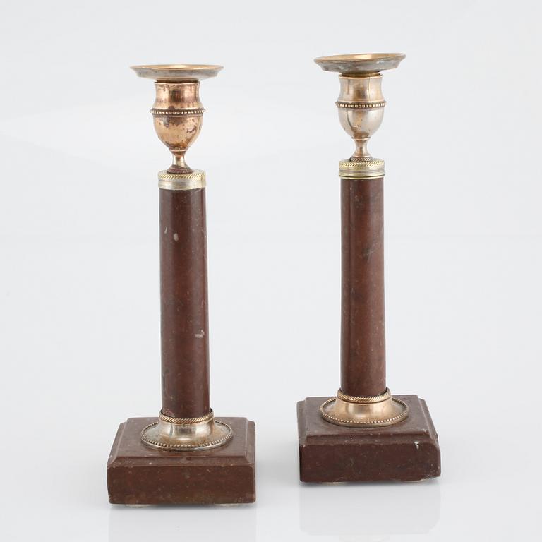 A pair of late gustavian candlesticks, made around year 1800.