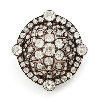558A. A brooch/pendant in gold and platinum with old-cut diamonds.