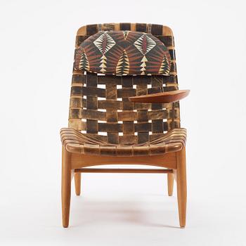 Arne Vodder, a woven leather lounge chair with attached side table, Bovirke, Denmark, 1950s.