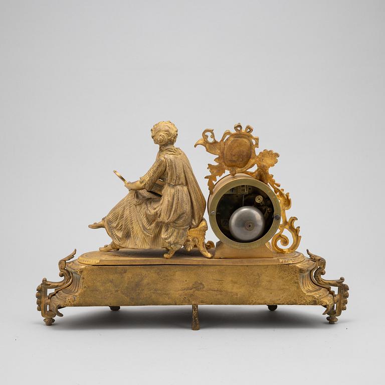 A Louis XVI-style ormolu and parcel gilt mantel clock, mid 19th Century.