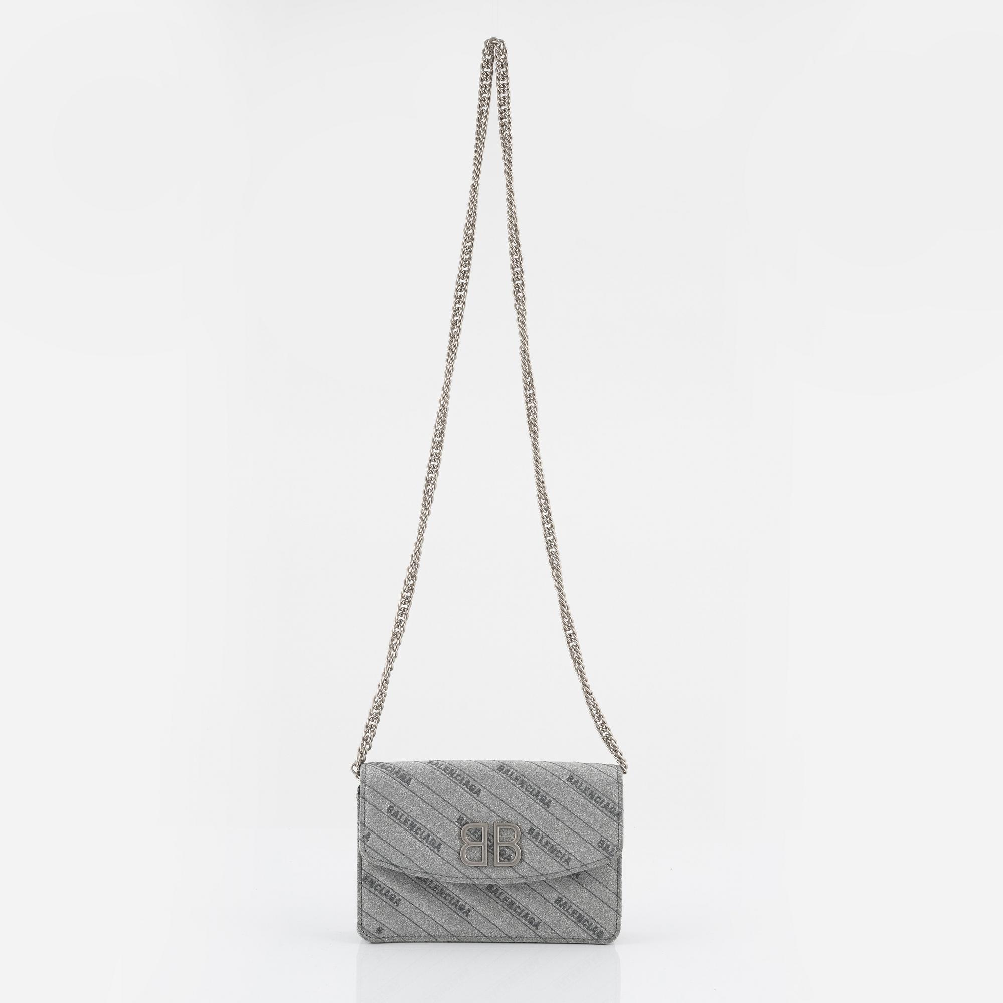 Balenciaga, a 'BB Round glitter bag'.