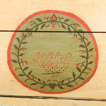 A wooden storage chest dated year 1777.