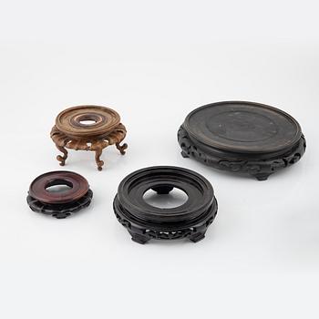 A group of nine hardwood stands, late Qing dynasty and 20th Century.