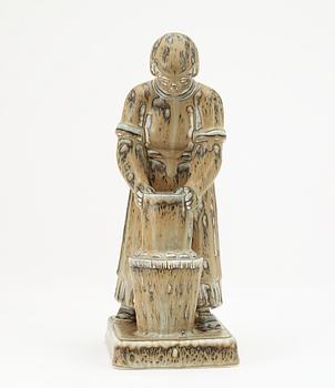 A Gunnar Nylund stoneware sculpture of a dairymaid, Rörstrand.