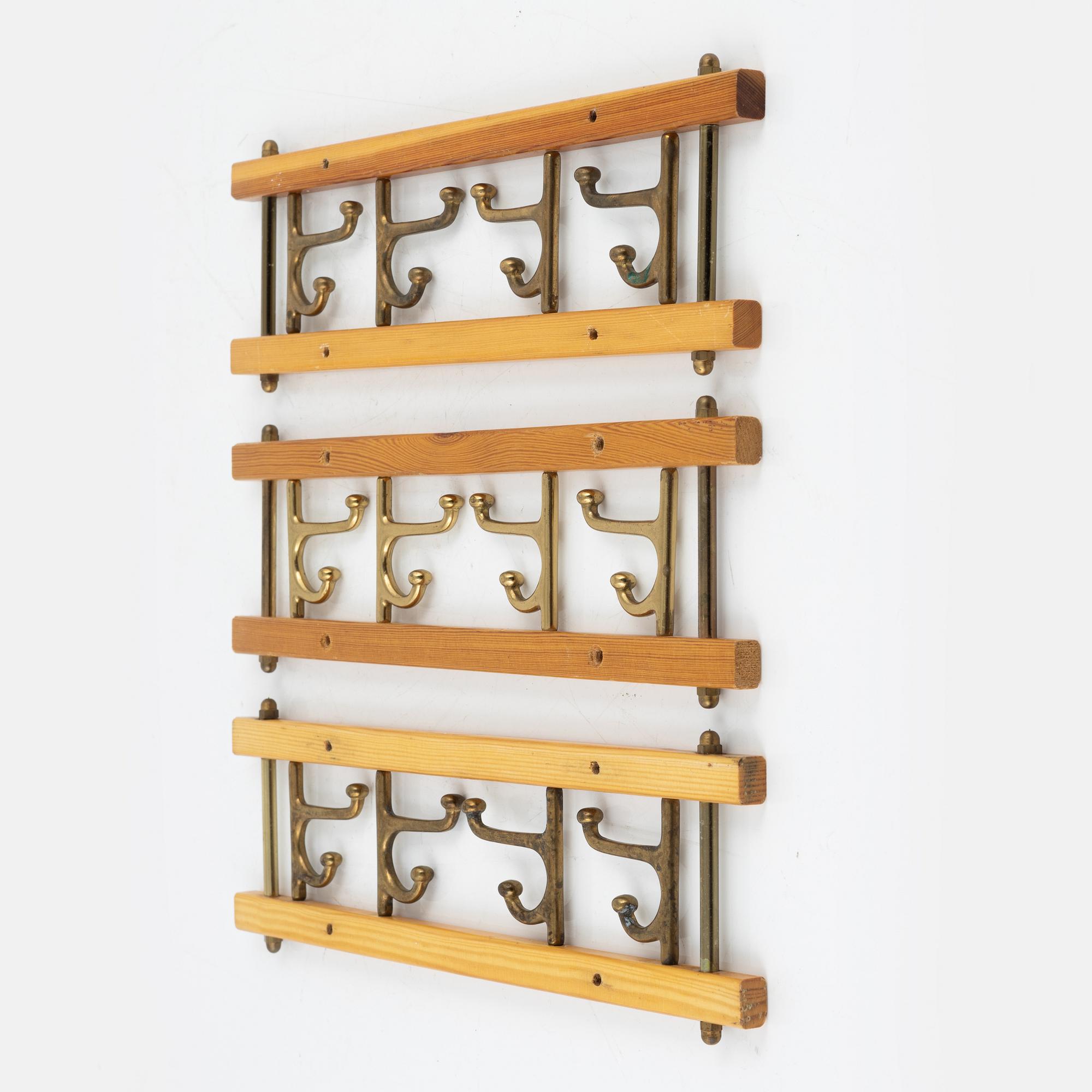 A group of three 'Dekorativ' coat hangers, Skoglunds metallgjuteri, Anderstorp, 1950's/60's.