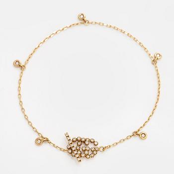 Gucci, rannekoru, "Interlocking", 18K kultaa briljanttihiottuine timantteineen.