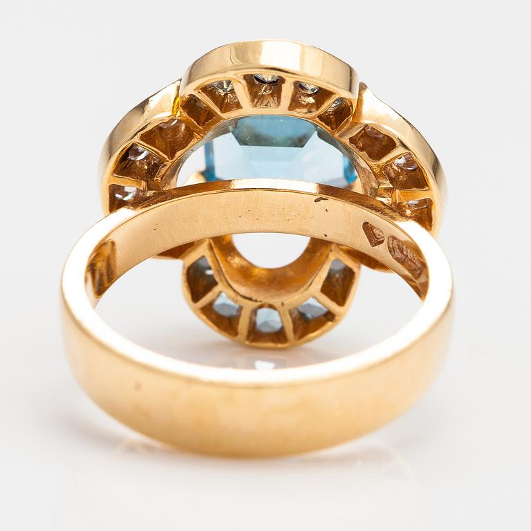 An 18K gold ring "Catherine Jagiellon" with diamonds ca 0.37 ct in total and topazes. Ofelia Jewelry, Helsinki 1998.