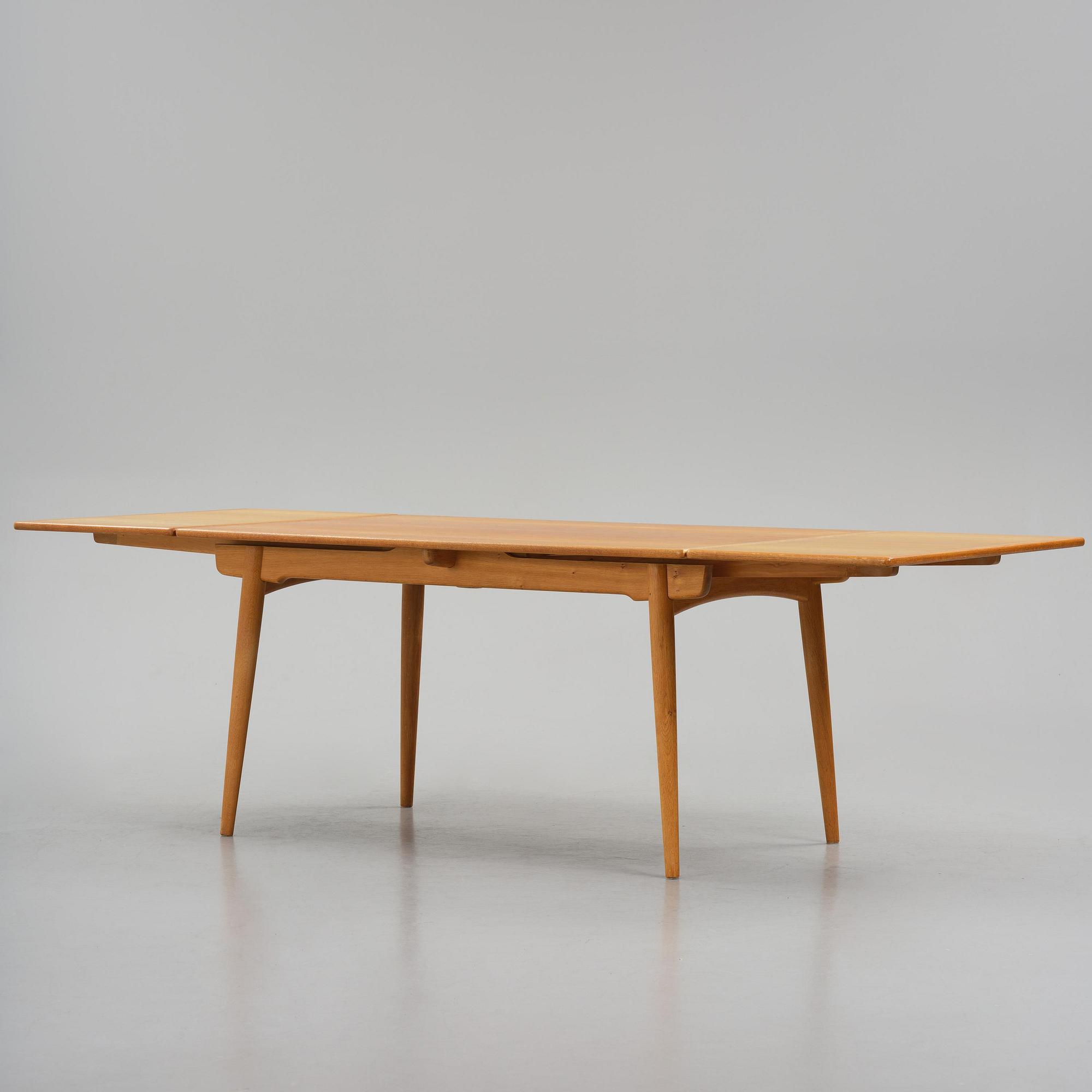 Hans J. Wegner, an "AT-312" dining table, Andreas Tuck, Denmark, 1950s-60s.