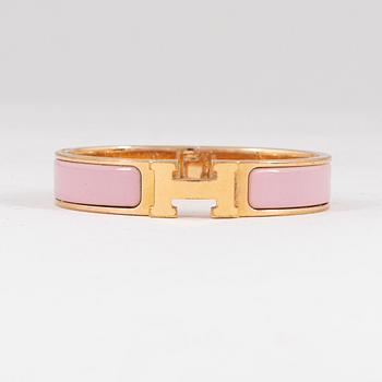 Hermès, a 'Clic H PM' bracelet.