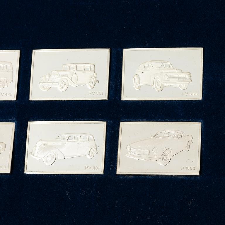Plaketter, 12 st, silver, "De Historiska Volvobilarna 1927-1977", Franklin Mint.