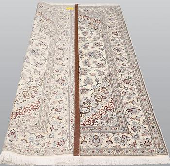 A Nain part silk carpet, 244 x 156 cm.