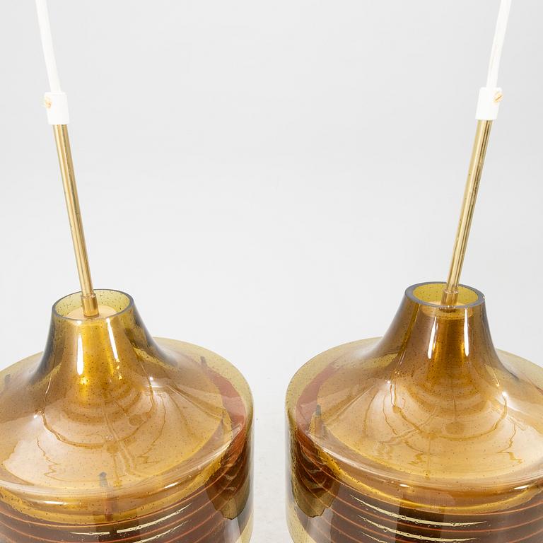 A pair of Fagerhult glass and brass ceiling pendants 1960/70s.