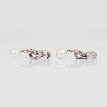 A pair of cultured pearl and diamond earrings.