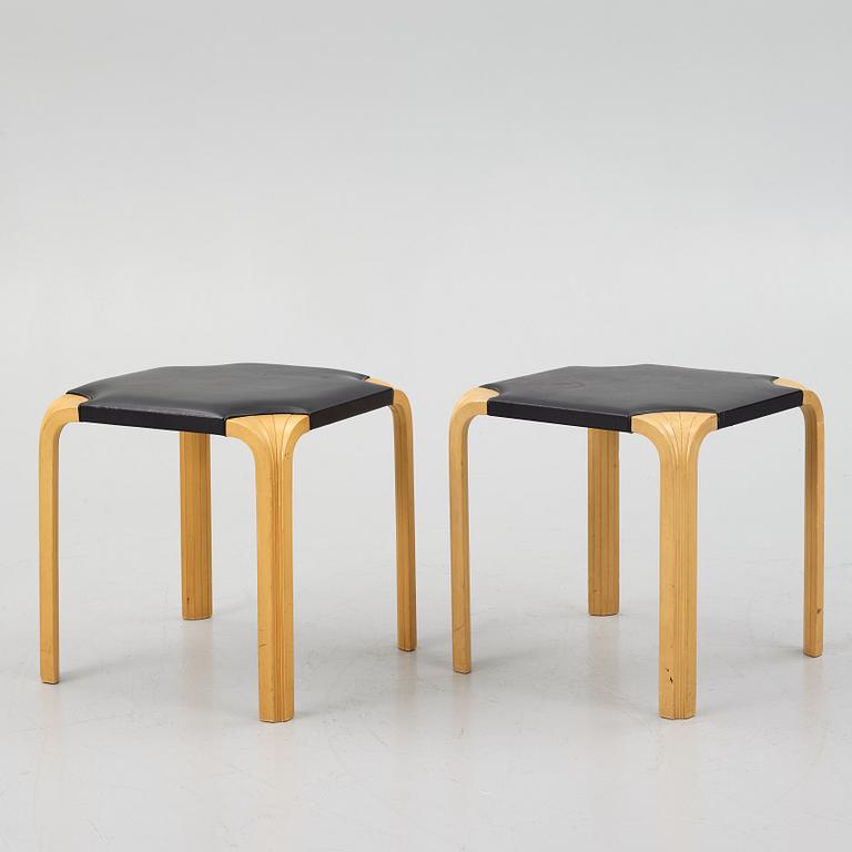 Alvar Aalto, a pair of 'X601' stool for Artek, later half of the 20th century.