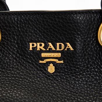 Prada, A 'Vitello Daino Tote' bag.