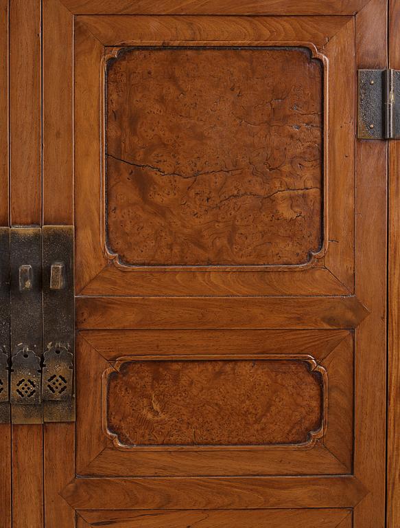 A huanghuali veneered, huamu and mixed wood cabinet, 19th century, Qing dynasty, 19th Century.