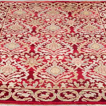 A RUG, a semi-antique Spanish, ca 239,5 x 167,5 cm (as well as ca 2 cm flat weave at the ends),