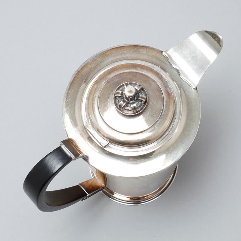 A silver coffee pot, sugar bowl and creamer by Thore Eldh for K&EC in Göteborg, 1949.