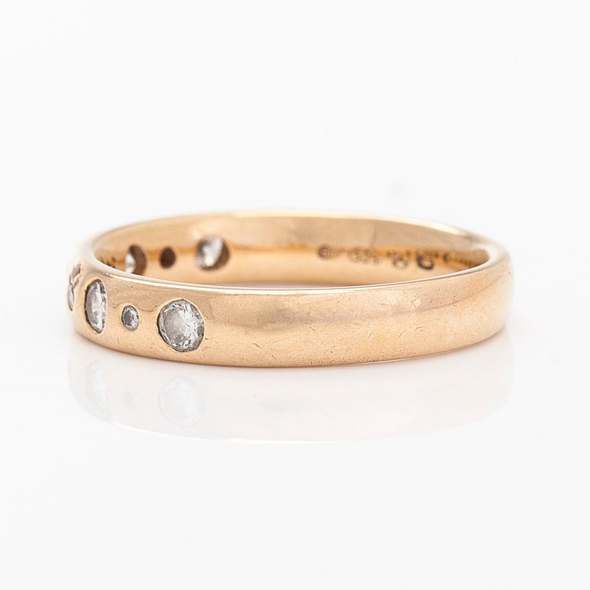 A 14K gold half eternity ring, set with brilliant-cut diamonds, total approximately 0.26 ct. Finnish import marks  1997.