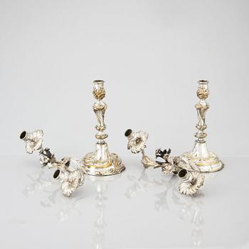 A pair of Swedish Rococo argent haché candelabra.