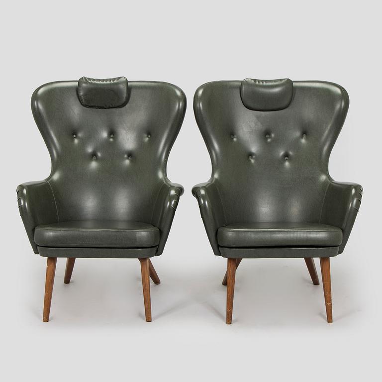 A pair of mid-20th century armchairs.