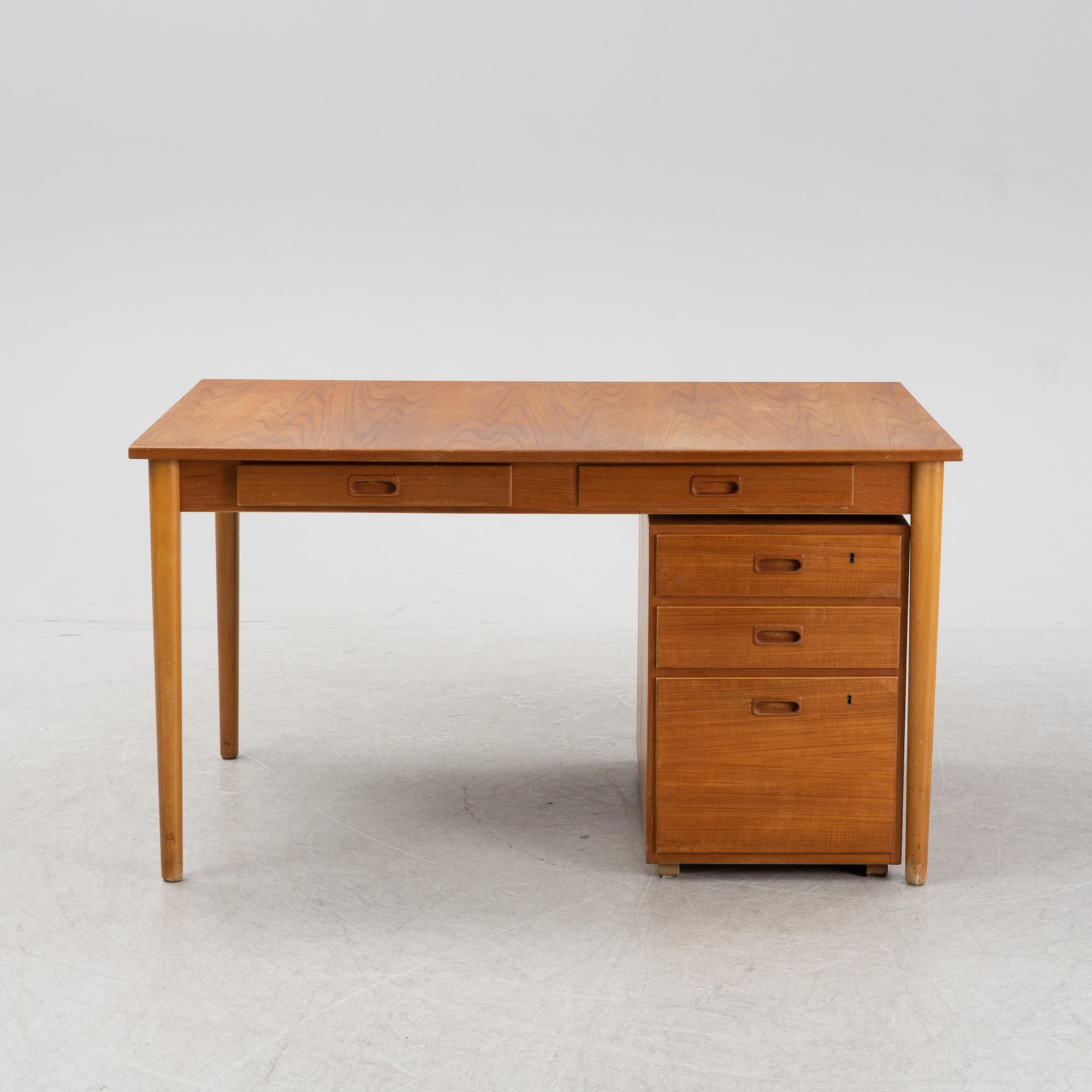 A desk with a drawer unit, Bra Bohag, Hugo Troeds, Bjärnu, mid 20th Century.