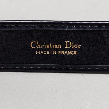 CHRISTIAN DIOR, a set of a clutch, a belt and an umbrella.