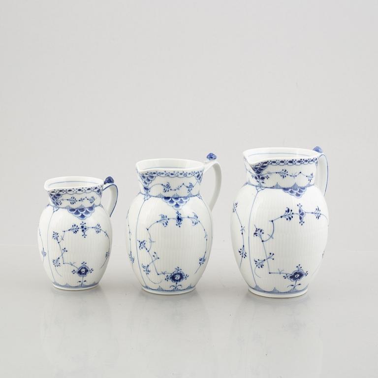 Three 'Blue Fluted Half Lace' / 'Musselmalet' porcelain jugs, Royal Copenhagen, model 562, 561, 763, 1898-1923 and 1962.