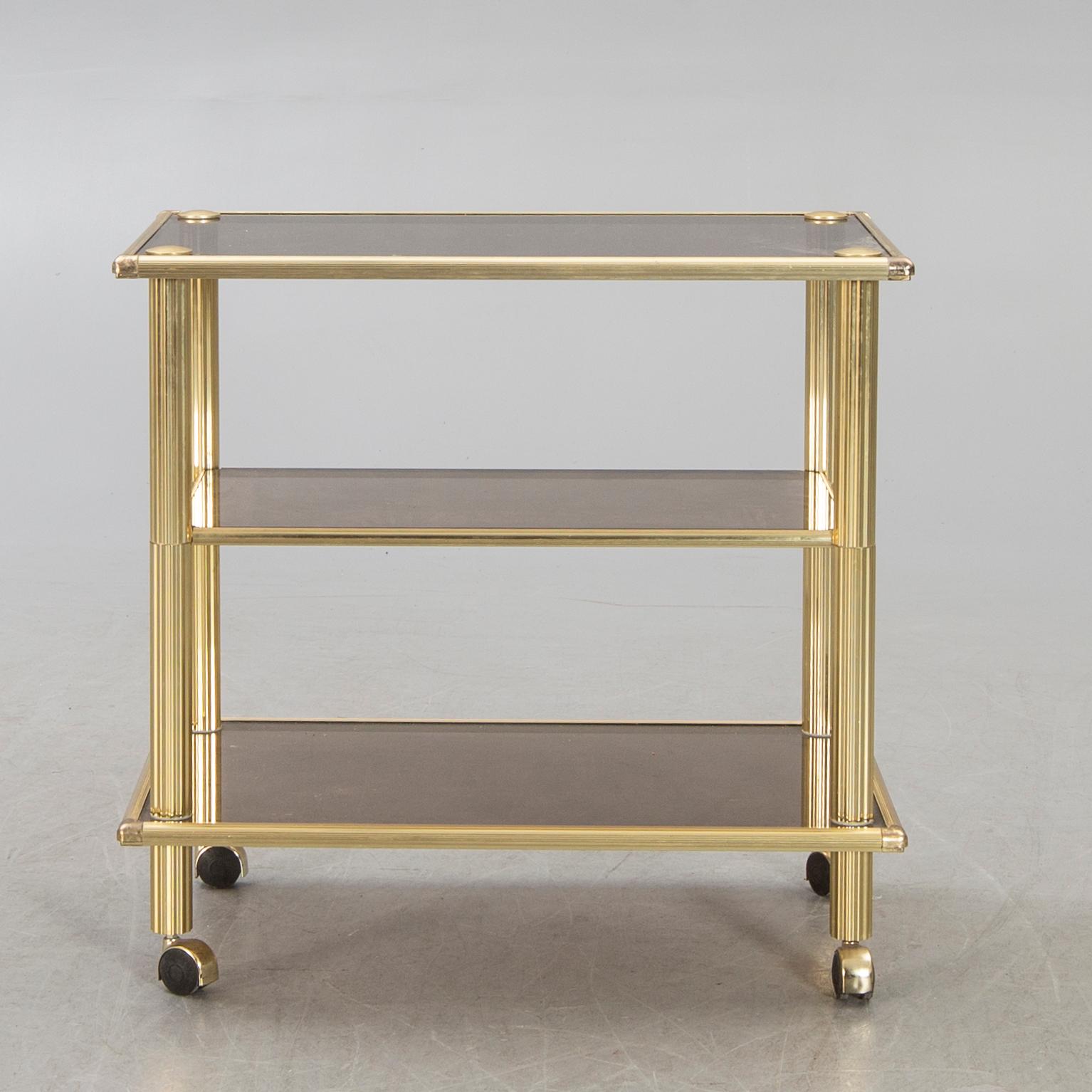 A brass serving trolley later part of the 20th century.