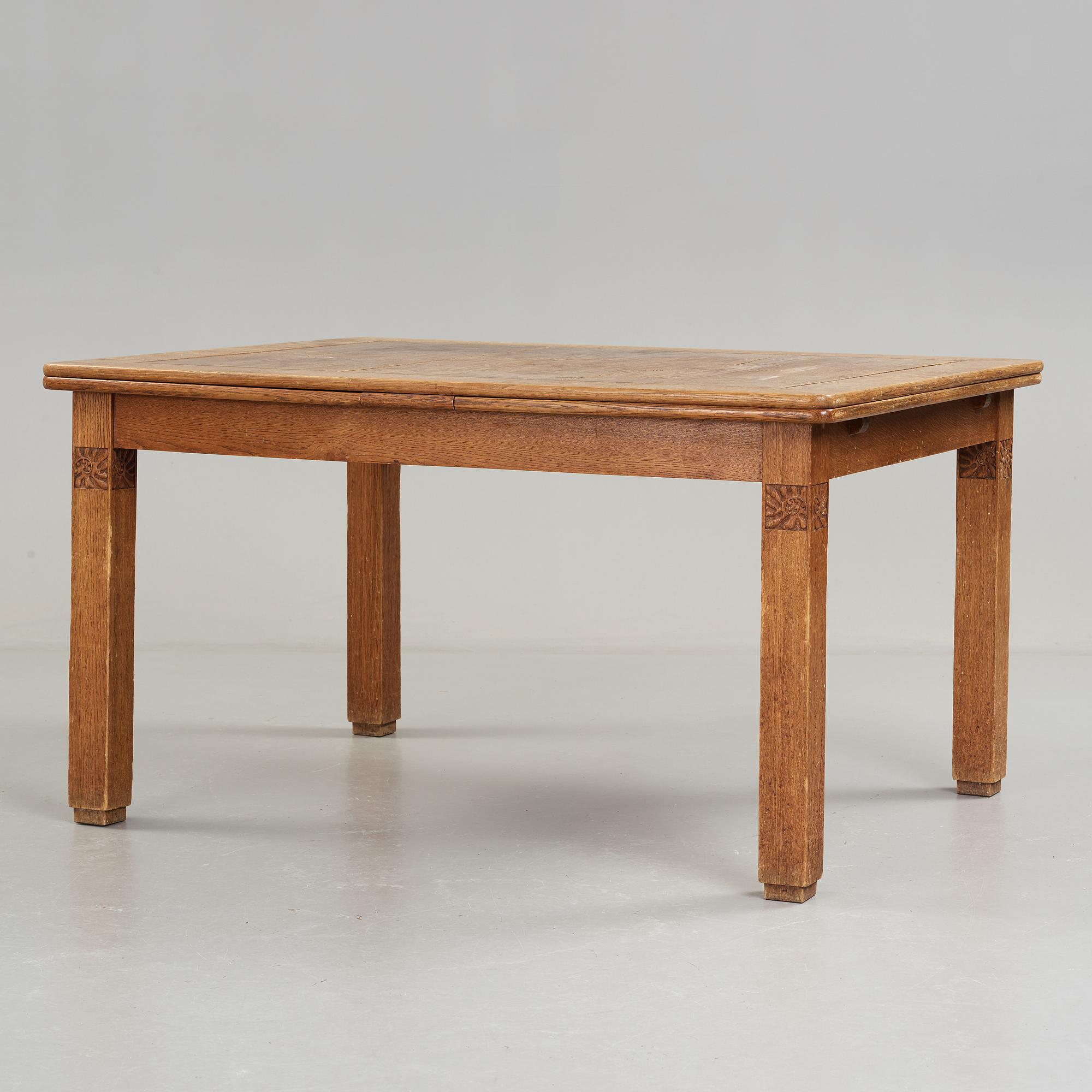 A Art Nouveau oak set with dining table, seven chairs and a side table, Finland, early 1900's.