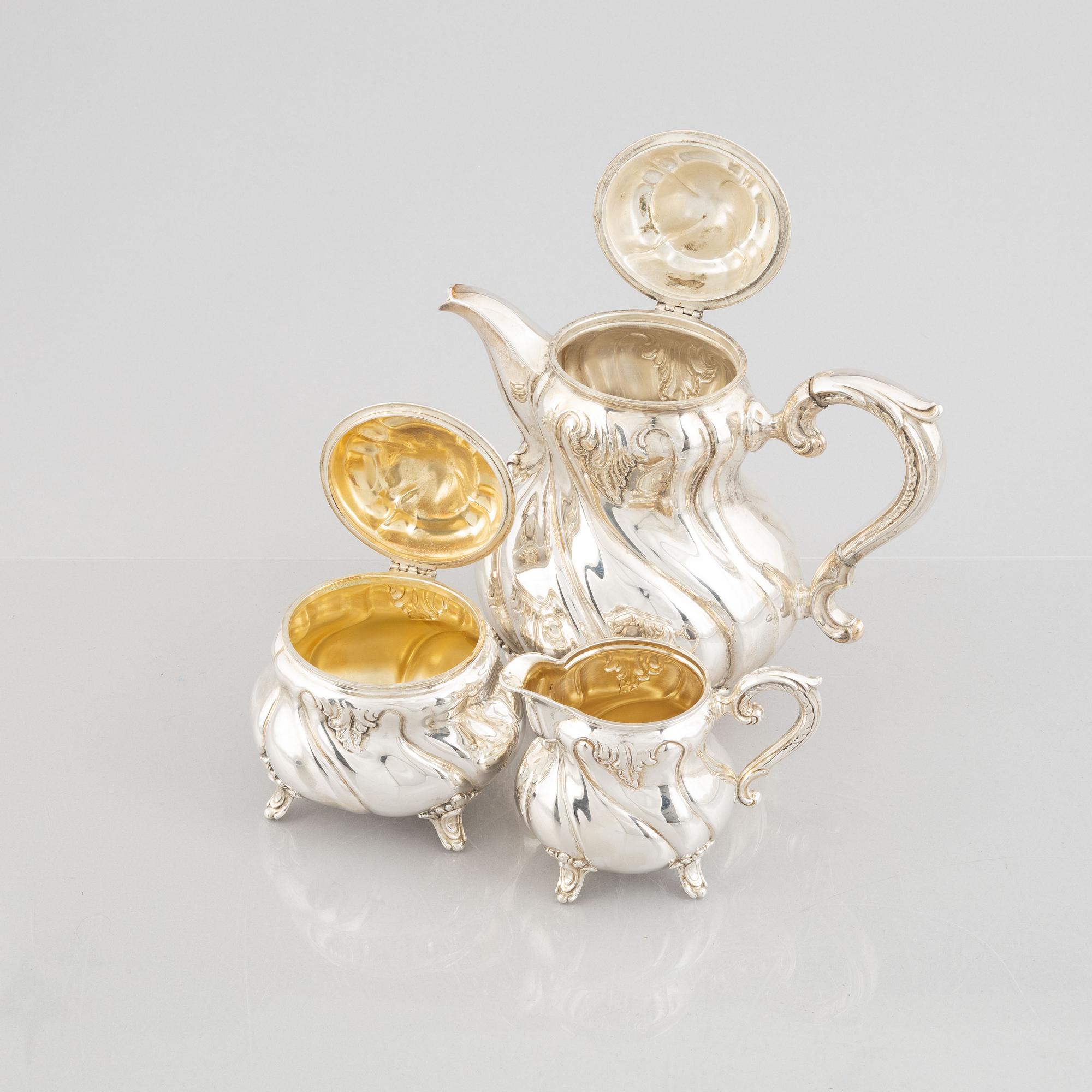 A German Rococo-Style Silver Coffee Pot, Creamer and Sugar Bowl, mark of MH Wilkens & Söhne, Bremen-Hemelingen.