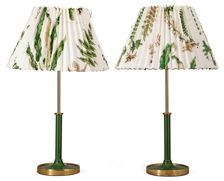 A pair of Josef Frank brass and green lacquered table lamps by Svenskt Tenn, model 2466.