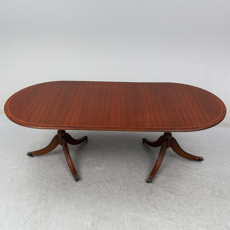 A late 20th century English dining table. One leaf included.