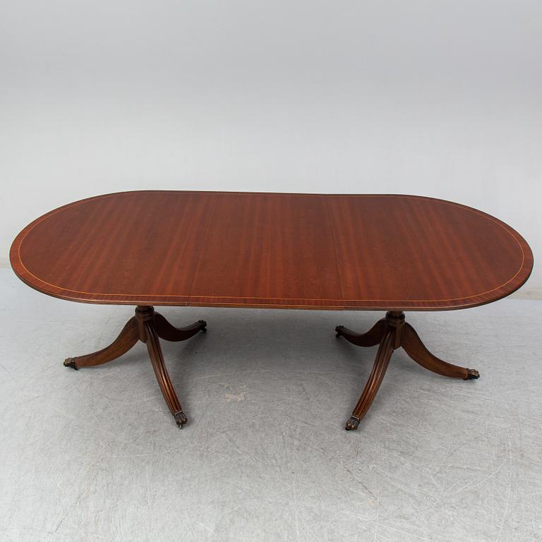 A late 20th century English dining table. One leaf included.